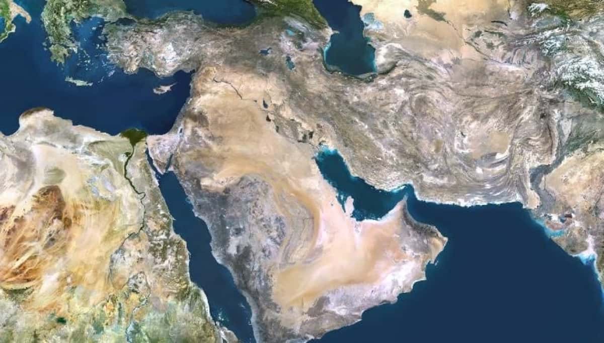 Middle East, true colour satellite image. North is at top. Vegetation is green, water is dark blue and bare ground, mostly desert, is yellow-brown. At centre is the Arabian Peninsula, mainly comprising Saudi Arabia, bordered on the left by the Red Sea and on the right by the Persian Gulf and the Arabian Sea (bottom right). Iran lies between the Caspian Sea (top right) and the Persian Gulf. To the right of Iran are Afghanistan and Pakistan, and to the left is Iraq. North-east Africa is at lower left. The Nile delta (green) of Egypt is clearly seen draining into the Mediterranean Sea (upper left). This image was compiled from data acquired by LANDSAT 5 & 7 satellites., Middle East, True Colour Satellite Image (Photo by Planet Observer/Universal Images Group via Getty Images)