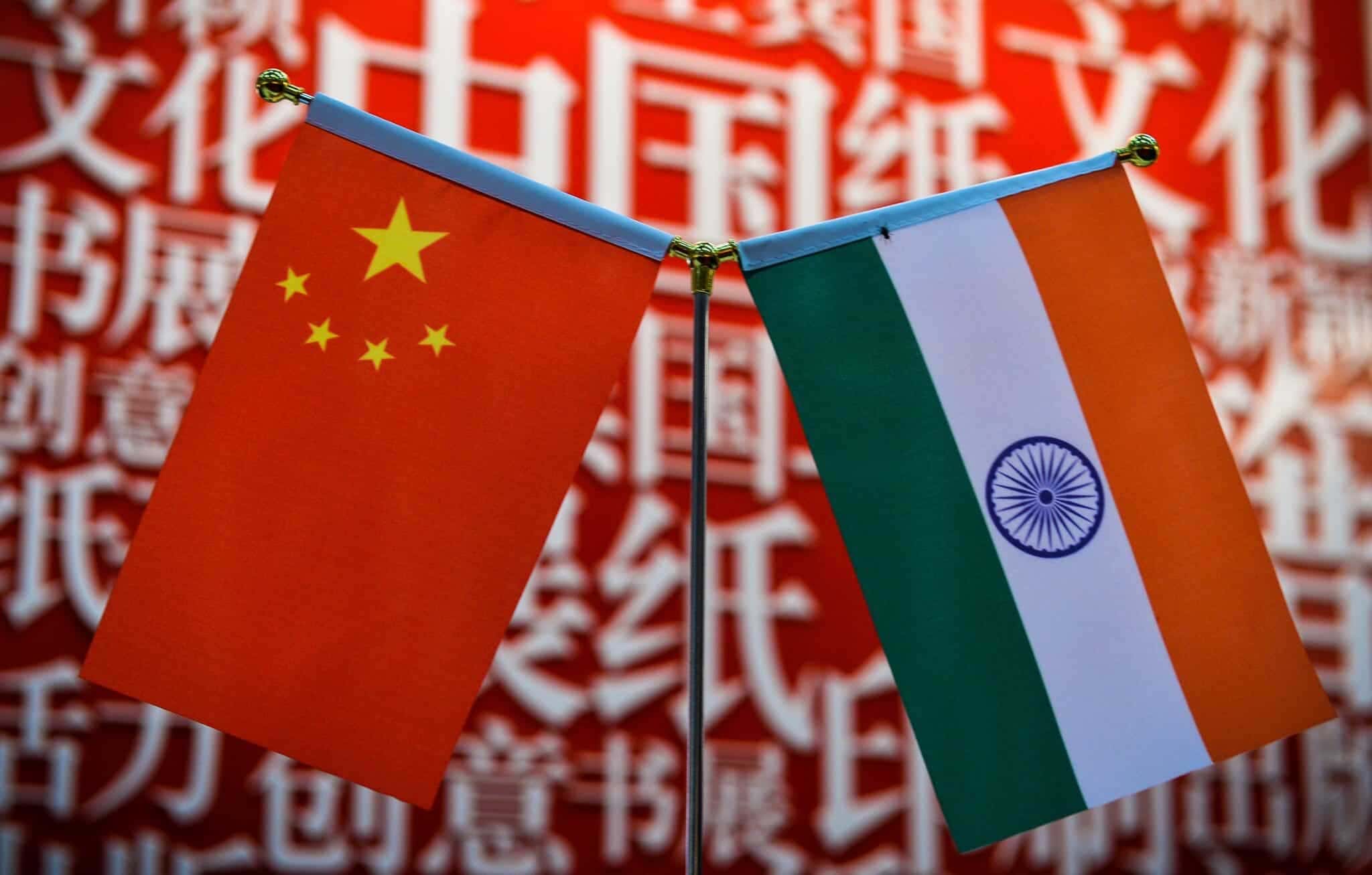 The national flags of India (R) and China are seen at the Delhi World Book fair at Pragati Maidan in New Delhi on January 9, 2016. AFP PHOTO / CHANDAN KHANNA / AFP / Chandan Khanna (Photo credit should read CHANDAN KHANNA/AFP via Getty Images)