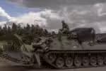 Ukrainian servicemen operate an armoured military vehicle in the Sumy region, near the border with Russia, on August 13, 2024, amid the Russian invasion of Ukraine. Ukraine's shock border offensive into Russia's Kursk region has been one of Ukraine's speediest operations since Moscow invaded in February 2022. Analysts say it is the most significant ground operation by a foreign army inside Russia since World War II. For Ukraine, it has been a morale boost at an otherwise perilous moment in the war. (Photo by Roman PILIPEY / AFP)