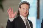 This photo taken on February 27, 2024 shows Mark Zuckerberg, head of US tech giant Meta, waving as he enters the Japanese prime minister's office during his visit to Tokyo. (Photo by JIJI Press / AFP) / Japan OUT