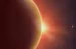 Abstract vector orange background with planet and eclipse of its star. Bright star light shine from the edge of a planet with a protuberance. Sparkles of stars on the background.