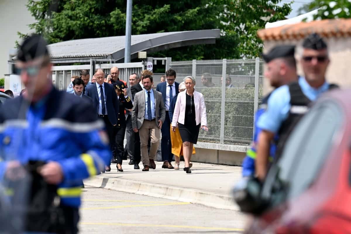 France's Minister of Education, Higher Education and Research Elisabeth Borne arrives at the secondary school where a 31-year-old teaching assistant was stabbed with a knife by a 15-year-old pupil during a bag search in Nogent, eastern France, on June 10, 2025. The teaching assistant, who died of her wounds, received several knife wounds just as classes were starting, and the alleged attacker, who was overpowered by gendarmes, "appears to be a student at the school," education officials said. (Photo by Jean-Christophe VERHAEGEN / AFP)