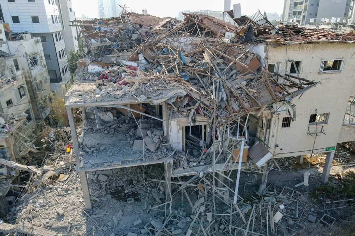 This aerial picture shows damaged buildings at a site hit by a missile fired from Iran in the Israeli city of Ramat Gan near Tel Aviv on June 14, 2025. Iran struck Israel early June 14, with barrages of missiles after a massive onslaught targeted the Islamic republic's nuclear and military facilities, and killed several top generals. (Photo by Jack GUEZ / AFP)