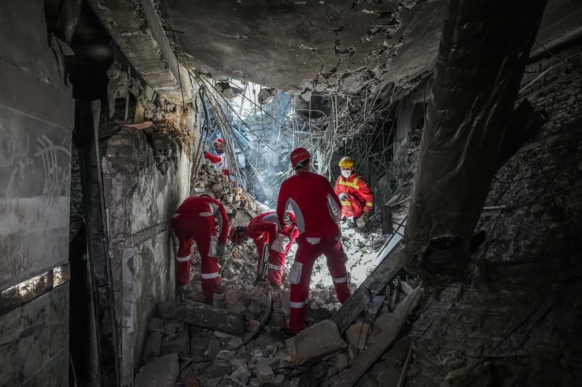 Rescuers sift through the rubble inside in the Evin prison complex in Tehran that was hit days ago by an Israeli strike, on June 25, 2025. The Israeli defence minister announced strikes on the prison and other domestic security agencies in Tehran on June 23. (Photo by Mostafa Roudaki / mizanonline / AFP)