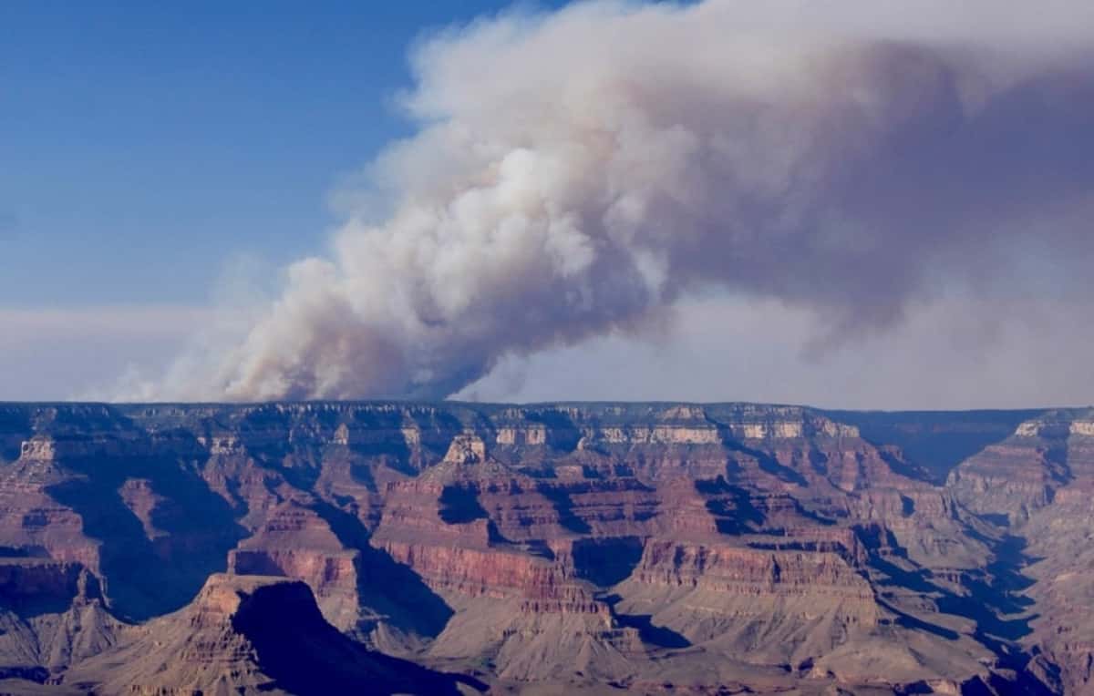 This handout image released by the Grand Canyon National Park Service via X (formerly Twitter) on July 11, 2025 shows smoke from the Dragon Bravo Fire on the North Rim of Grand Canyon National Park in Arizona. Grand Canyon Park has decided to close its North Rim to tourists for the remainder of the 2025 season, due to a fire that destroyed several dozen buildings in the area. "The North Rim will remain closed to all visitor access for the remainder of the 2025 season," which runs until October 15, the park announced on July 13. (Photo by NATIONAL PARK SERVICE / AFP) / RESTRICTED TO EDITORIAL USE - MANDATORY CREDIT "AFP PHOTO / NATIONAL PARK SERVICE " - NO MARKETING - NO ADVERTISING CAMPAIGNS - DISTRIBUTED AS A SERVICE TO CLIENTS