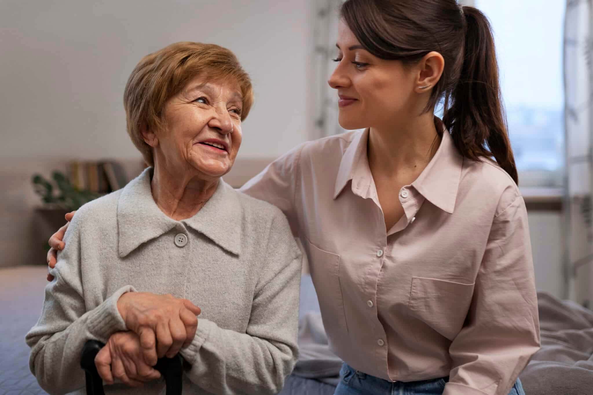female-nurse-taking-care-elderly-person-1-scaled-1