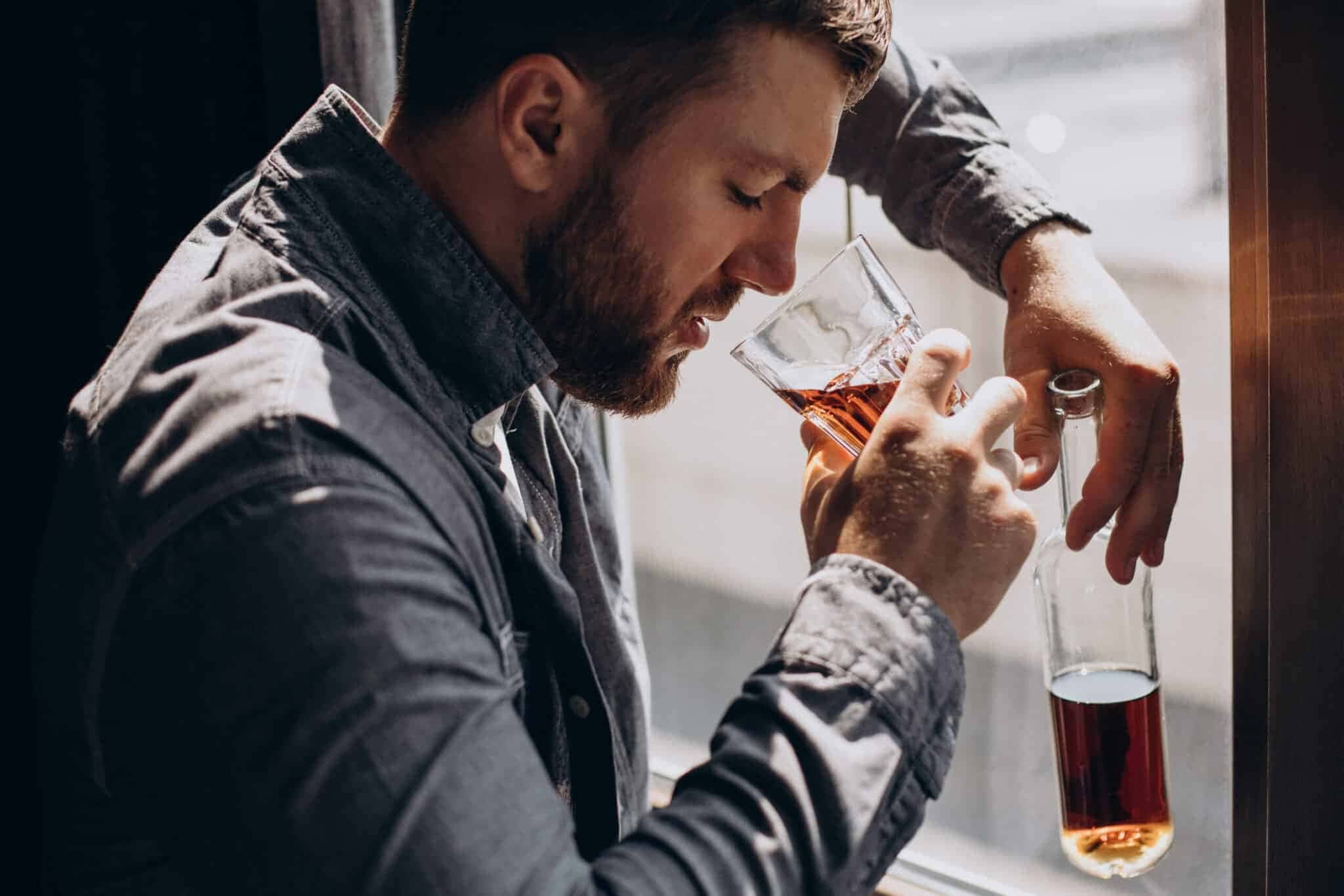 1_man-drinker-depressed-with-bottle-whiskey-scaled-1
