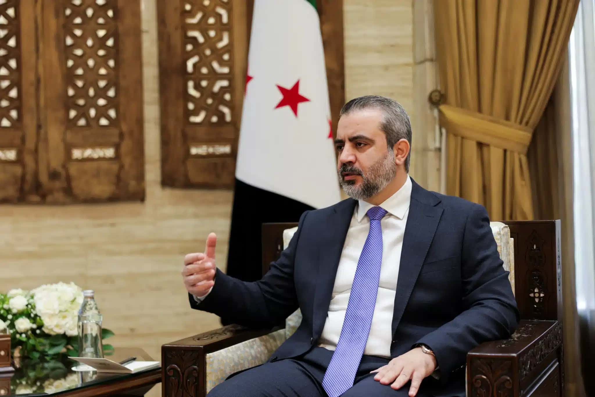 O ministro das Relações Exteriores da Síria, Asaad al-Shaibani, durante uma entrevista à Reuters em Damasco