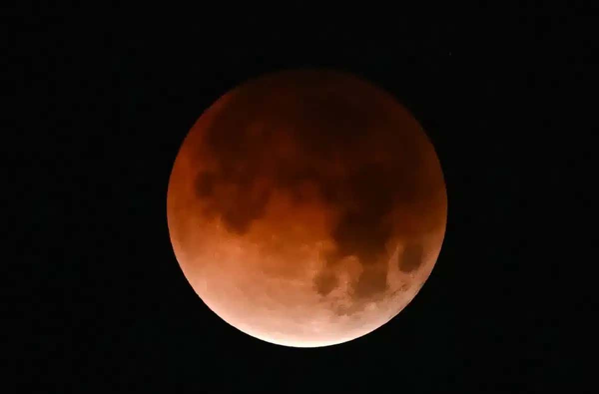 The moon is seen during a total lunar eclipse or "Blood Moon" in Mexico City on March 3, 2026. (Photo by Yuri CORTEZ / AFP)